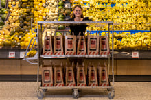 Grocery store worker with a purpose-built trolley-1